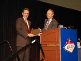Dr. Douglas K. Rex accepts a plaque from ACG President Dr. David A. Johnson commemorating the inaugural Emily Couric Lectureship